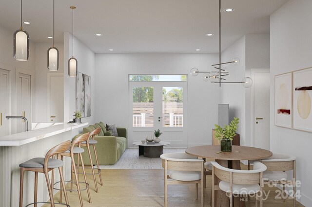 dining area featuring light wood-type flooring