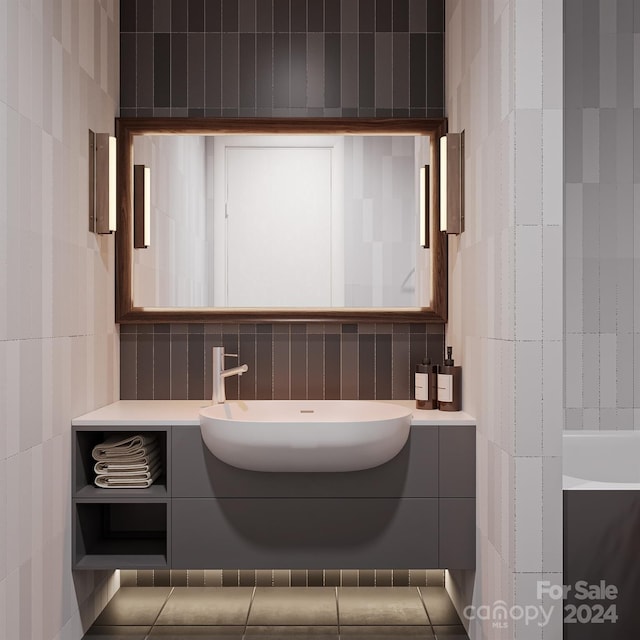 bathroom featuring vanity and tile walls