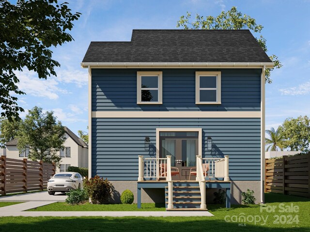 view of front facade featuring fence and french doors