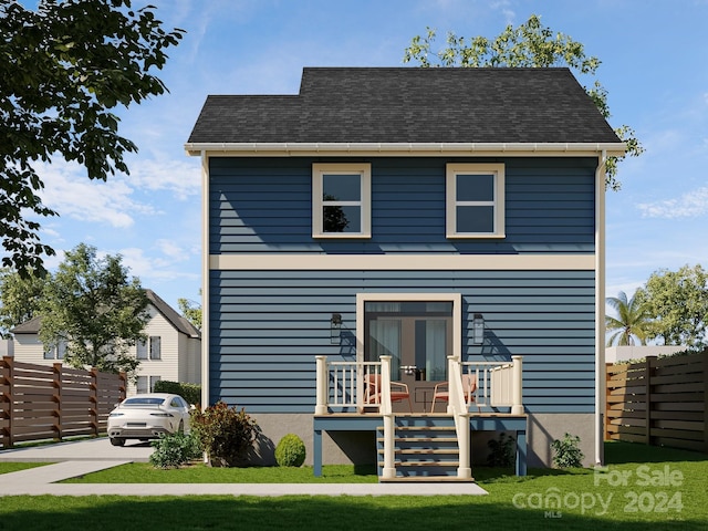 view of front of property with fence and french doors