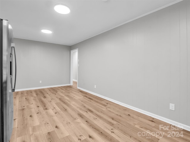 unfurnished room with light wood-type flooring