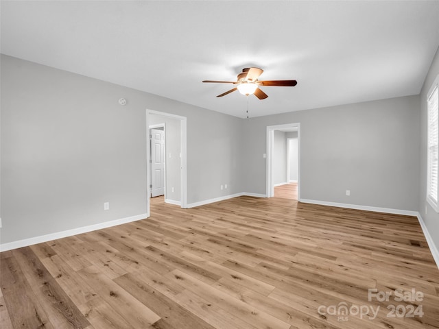 spare room featuring ceiling fan and light wood-type flooring