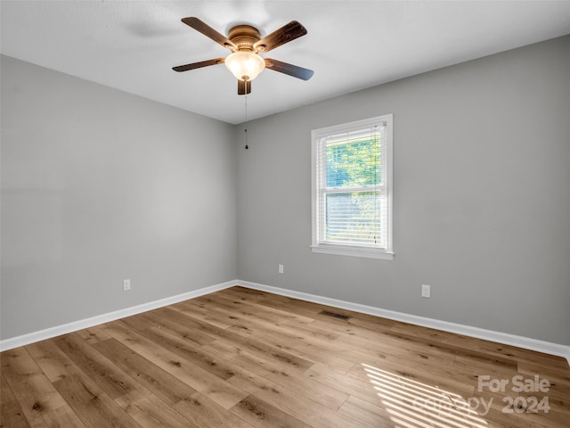 spare room with ceiling fan and light hardwood / wood-style floors