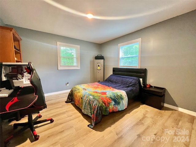 bedroom with light hardwood / wood-style floors