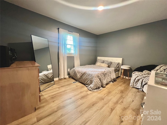 bedroom with light wood-type flooring