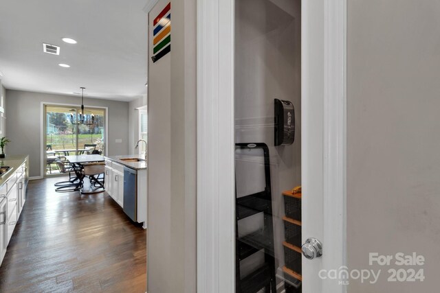 interior space featuring sink, dark hardwood / wood-style floors, and a chandelier