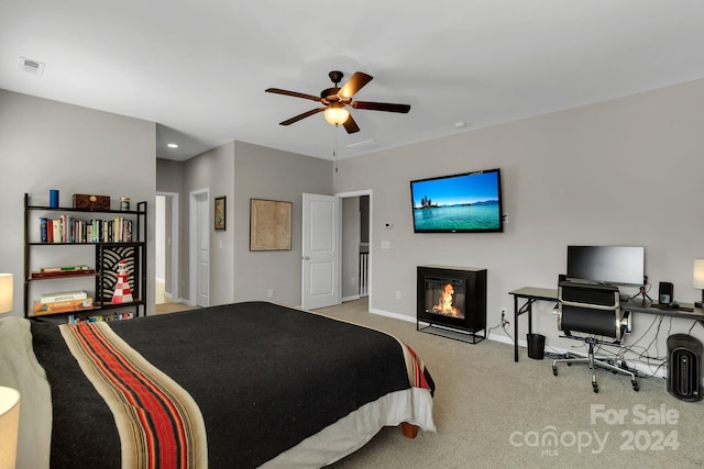 bedroom featuring light colored carpet and ceiling fan