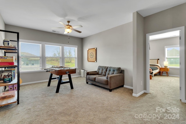 interior space featuring ceiling fan and a wealth of natural light