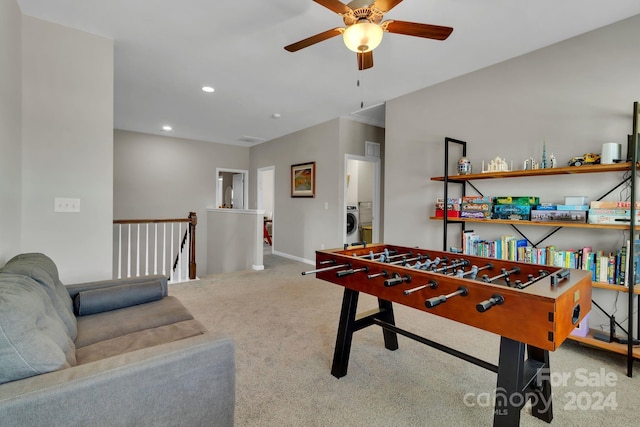 playroom featuring ceiling fan, carpet flooring, and washer / clothes dryer