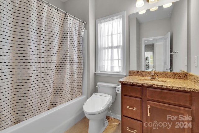 full bathroom featuring vanity, tile patterned floors, shower / bath combo with shower curtain, and toilet