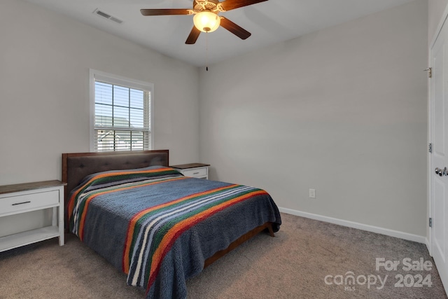 bedroom with light colored carpet and ceiling fan