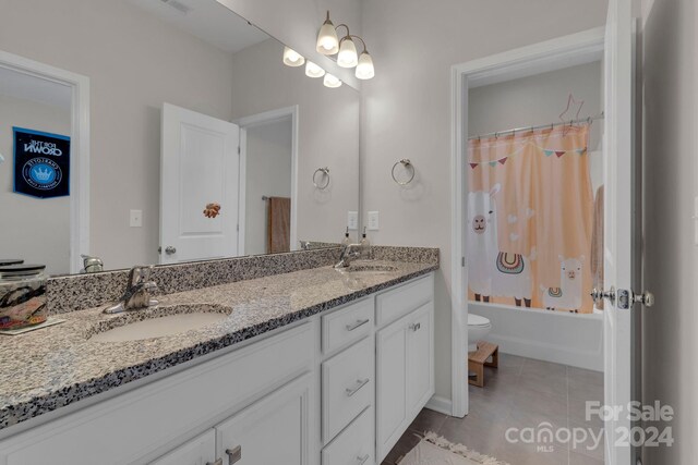 full bathroom with tile patterned flooring, double vanity, shower / bathtub combination with curtain, and toilet