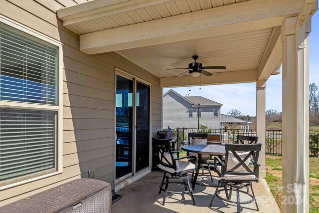 view of patio / terrace featuring ceiling fan