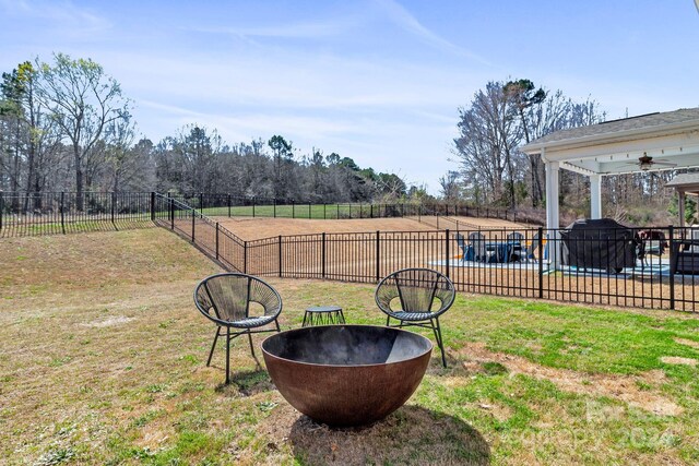 view of yard with ceiling fan