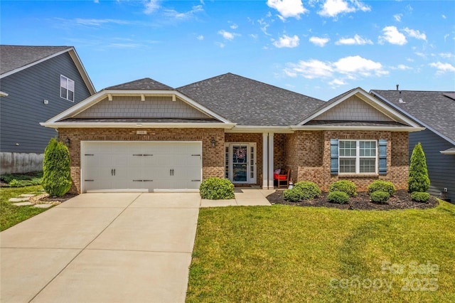 craftsman house featuring a garage and a front lawn