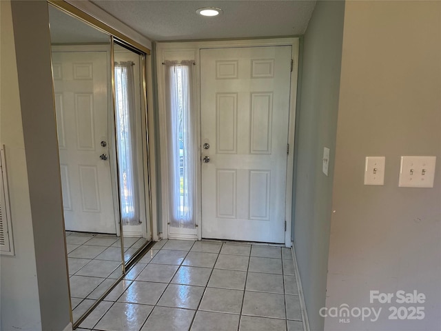 view of tiled foyer entrance