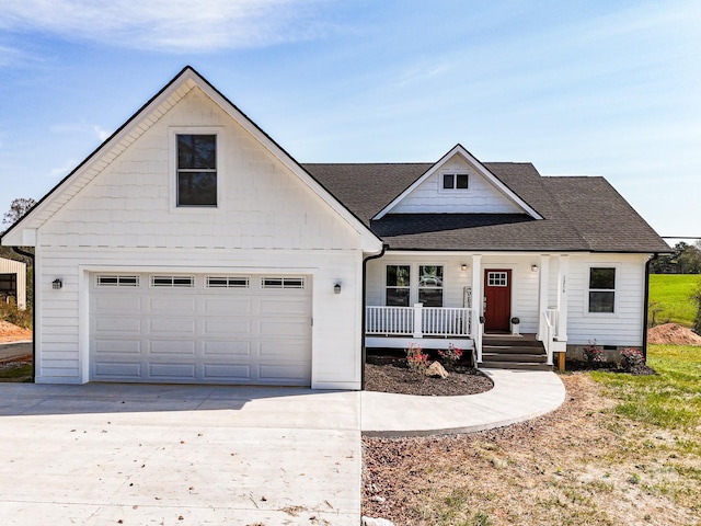 view of front of home featuring a porch and a garage