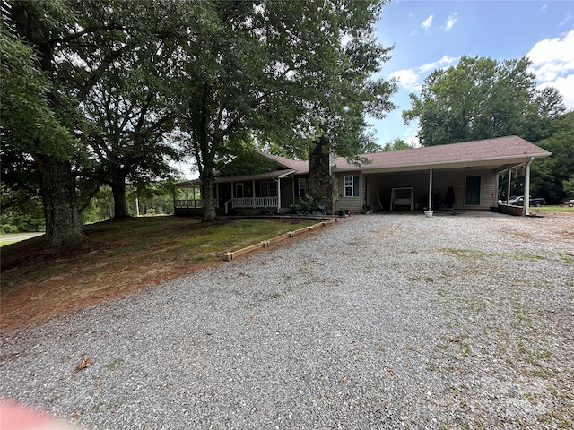 ranch-style home featuring a carport