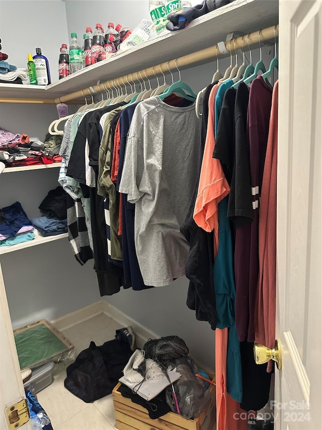 spacious closet featuring tile patterned flooring