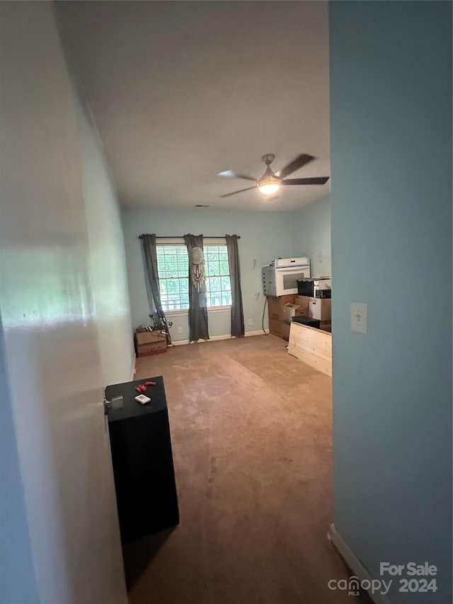 carpeted bedroom with ceiling fan