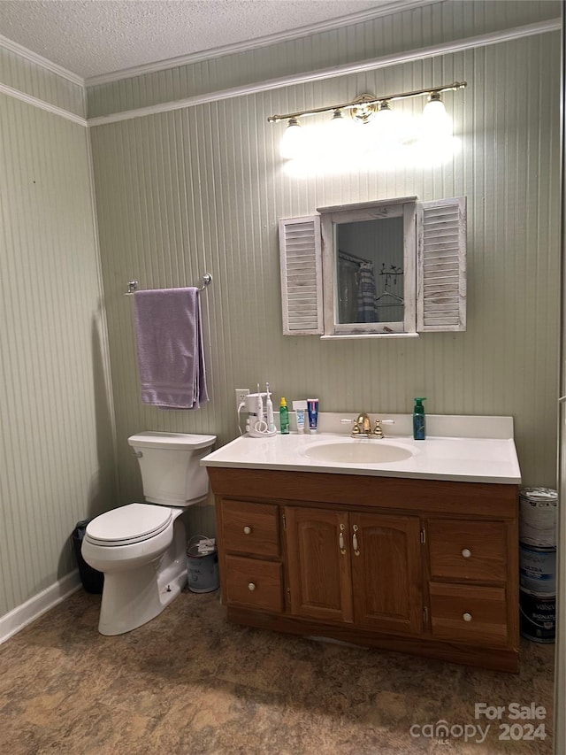 bathroom featuring toilet, a textured ceiling, and vanity