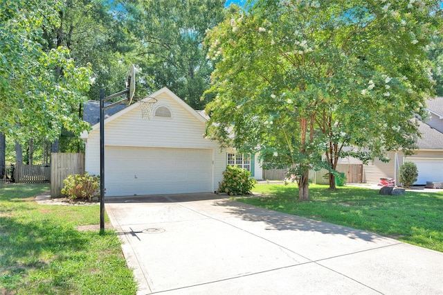 view of front of property featuring a garage and a front yard