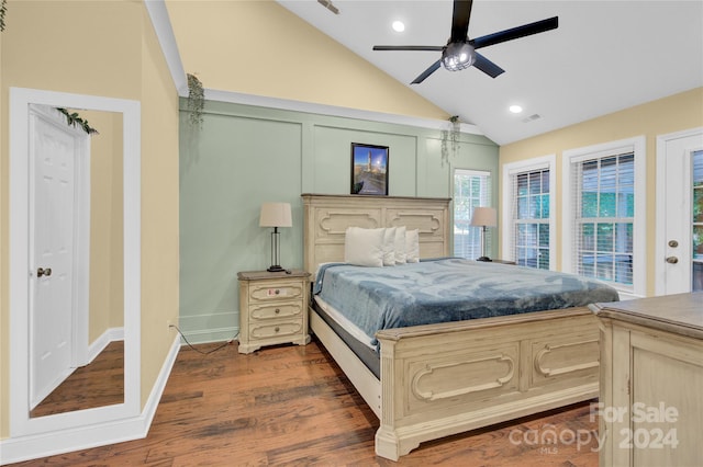 bedroom with ceiling fan, access to outside, dark hardwood / wood-style flooring, and lofted ceiling