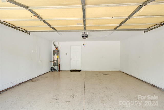 garage featuring gas water heater and a garage door opener