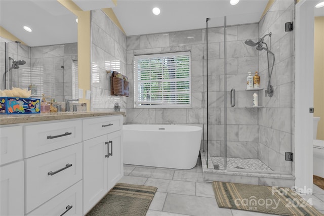 full bathroom featuring toilet, vanity, tile walls, separate shower and tub, and vaulted ceiling