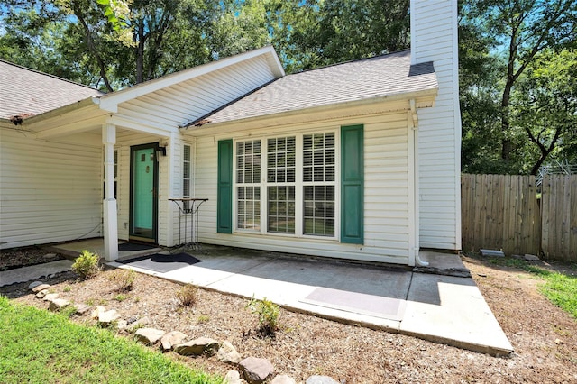 property entrance featuring a patio area