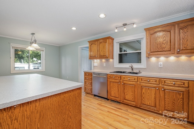 kitchen with light hardwood / wood-style flooring, stainless steel dishwasher, hanging light fixtures, sink, and ornamental molding