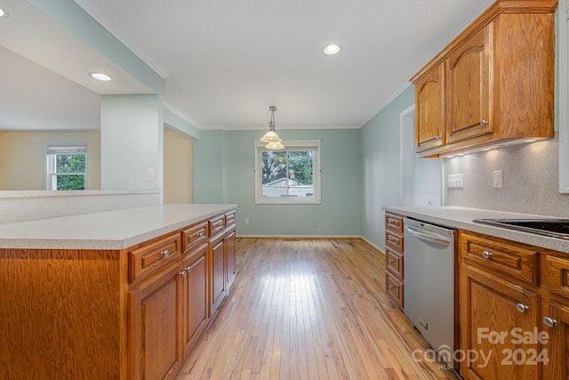 kitchen with dishwasher, light wood-type flooring, ornamental molding, and decorative light fixtures