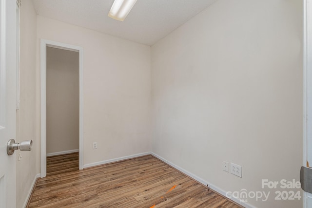 unfurnished room featuring hardwood / wood-style flooring