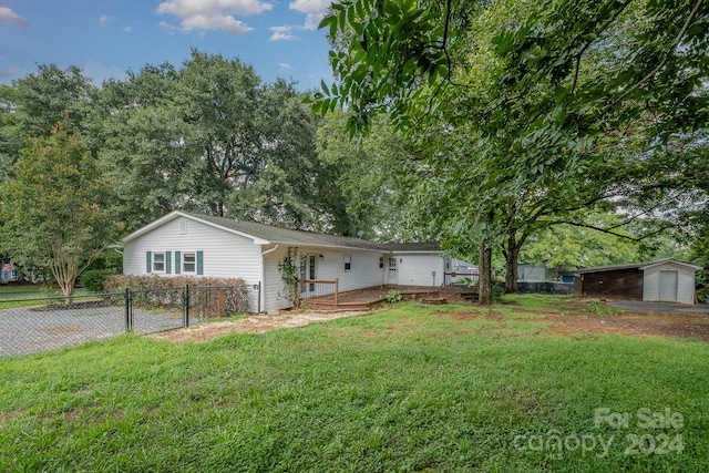 ranch-style home with a front lawn