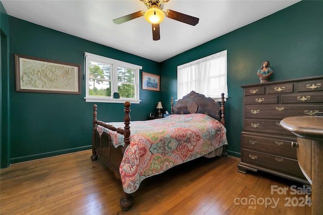 bedroom featuring ceiling fan and light hardwood / wood-style floors