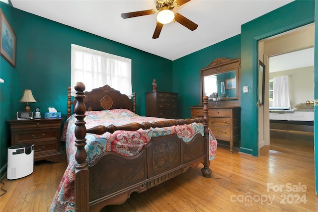 bedroom with light wood-type flooring and ceiling fan