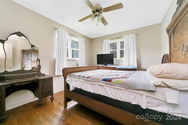 bedroom featuring hardwood / wood-style flooring and ceiling fan