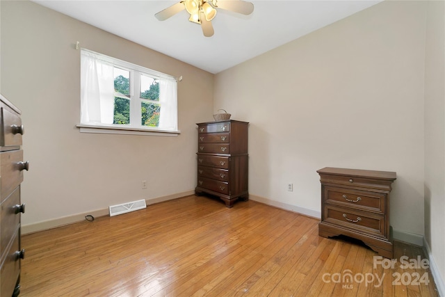 bedroom with light hardwood / wood-style flooring and ceiling fan