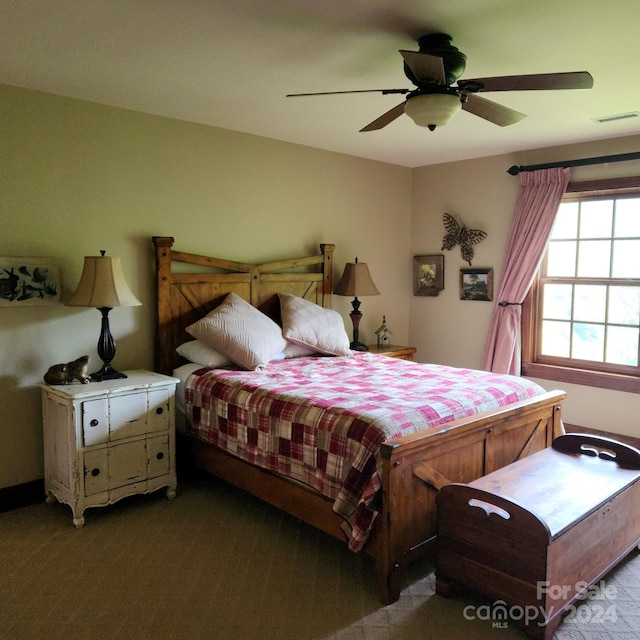 bedroom with ceiling fan and carpet floors