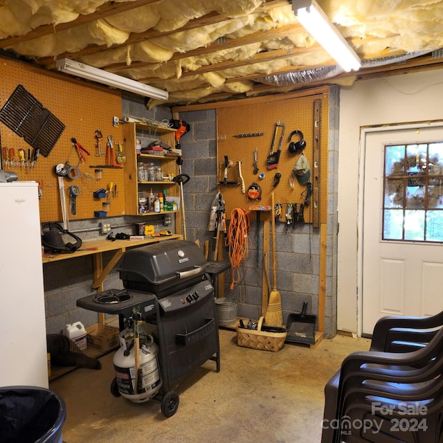 basement with a workshop area