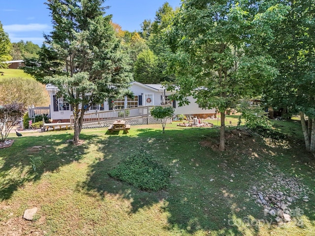 view of yard with a deck