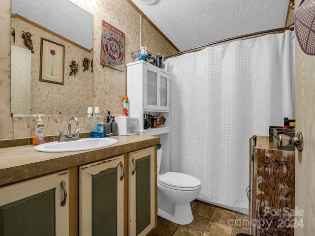 bathroom featuring tile patterned flooring, walk in shower, toilet, vanity, and a textured ceiling