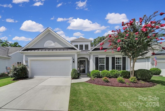 view of front facade with a front lawn and a garage