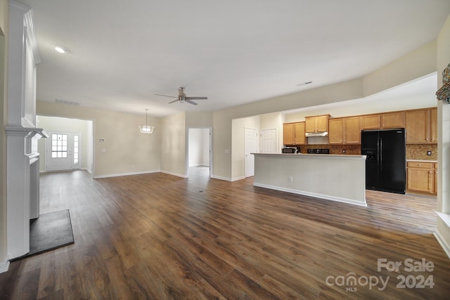 unfurnished living room with ceiling fan and dark hardwood / wood-style floors