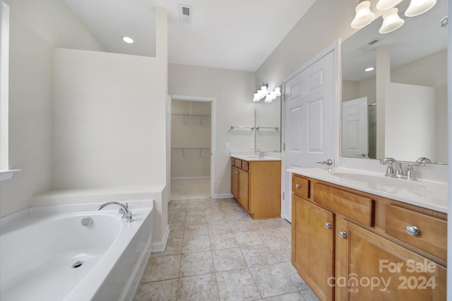 bathroom featuring vanity and a bathing tub