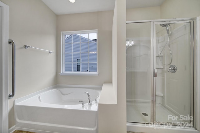 bathroom featuring plus walk in shower