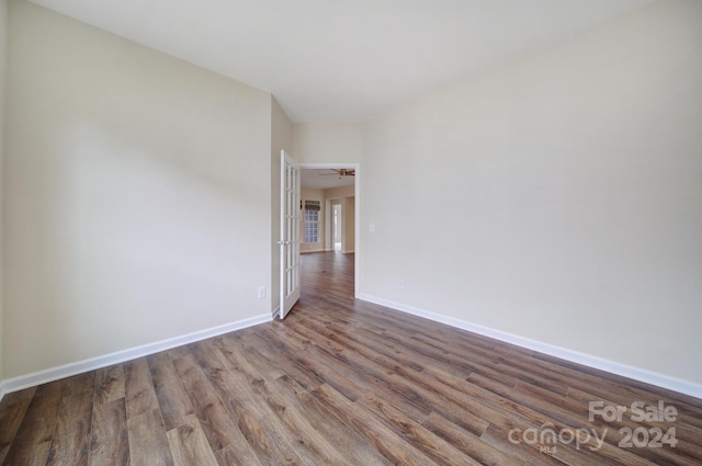 empty room featuring ceiling fan and wood-type flooring