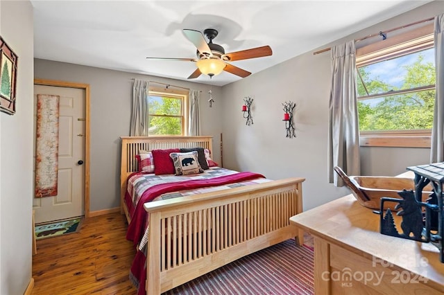 bedroom with ceiling fan and hardwood / wood-style floors