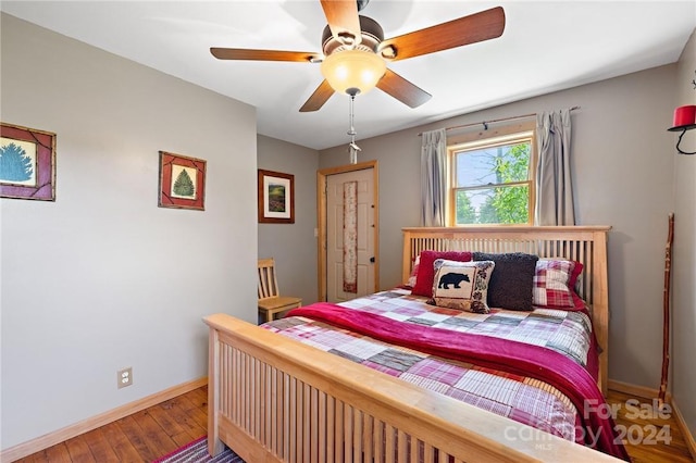 bedroom featuring ceiling fan, a closet, and hardwood / wood-style floors