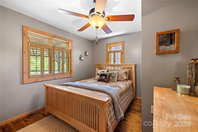 bedroom featuring ceiling fan and hardwood / wood-style floors